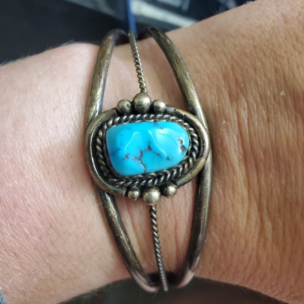 Vintage sterling turquoise cuff. Currently at about a 7 inch wrist but has quite